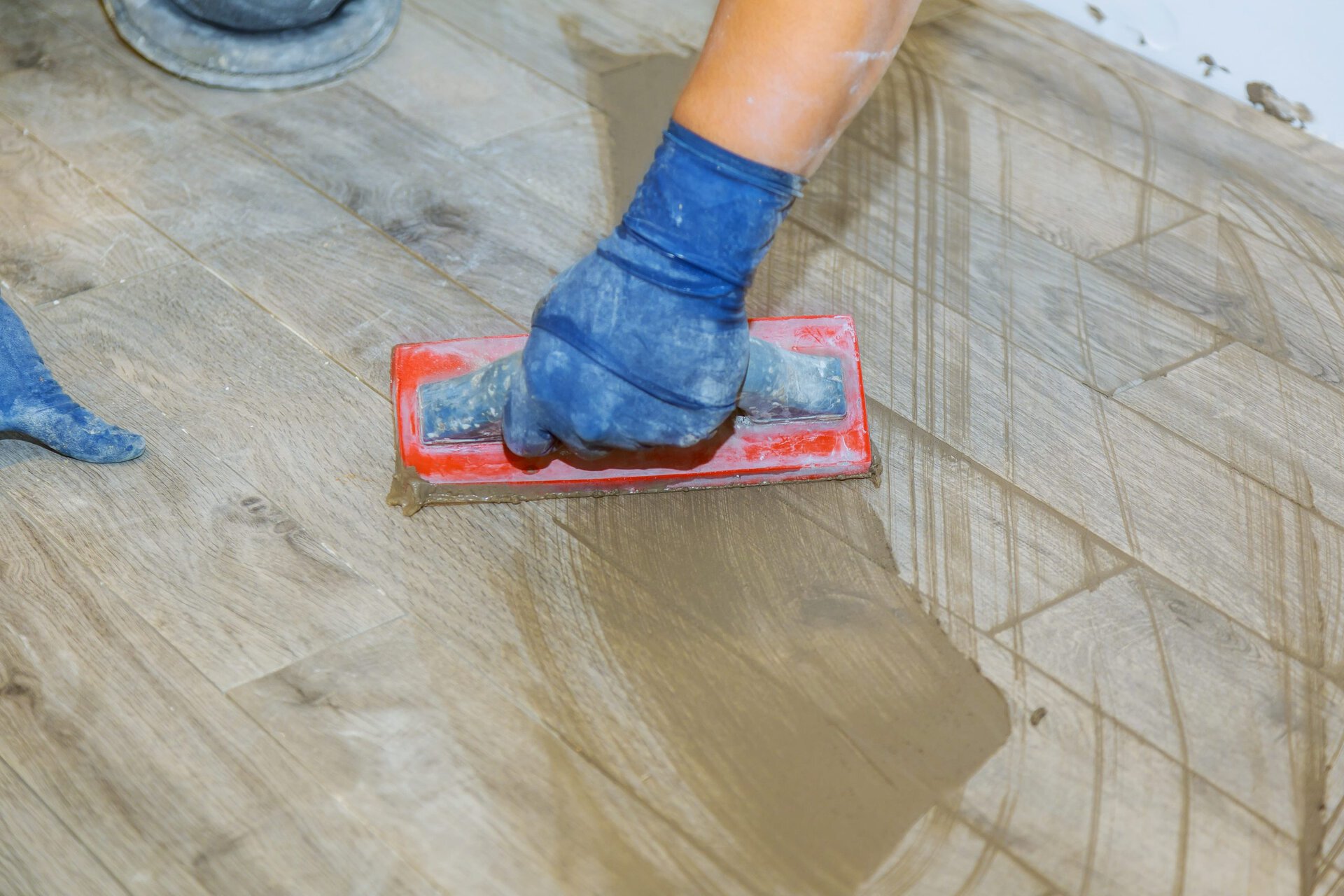 Grouting a tile floor